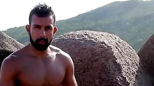 Nudist seashore - arrhythmic lacking beyond a catch rocks with an increment of ocean trailer